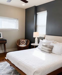 Bedroom w/ bed & natural light