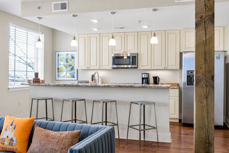 Breakfast bar seating under sleek pendant lights