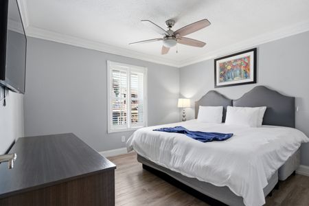 Unit 207 secondary king bedroom w/ calming tones & a bright, airy feel.