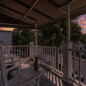 Balcony w/ chairs & a small table — a quiet spot to unwind.