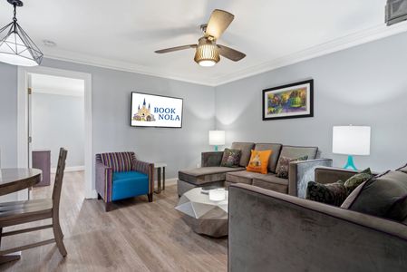 Stylish living area w/ plush sofas & pops of color for laid-back lounging.