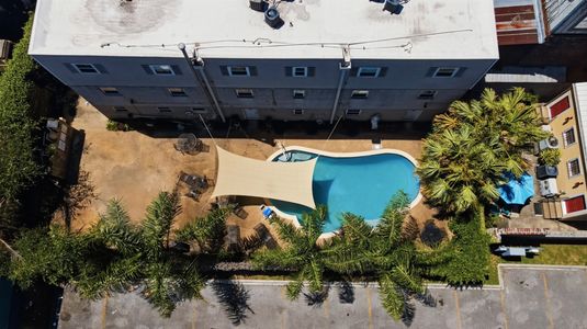 Bird's-eye view of the property nestled in a lively neighborhood.
