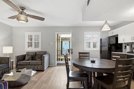 Spacious living & dining space w/ ceiling fan