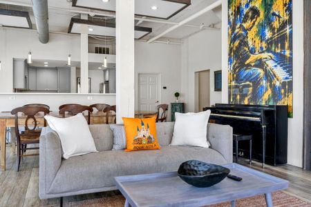 Cozy sofa corner with a piano for music lovers