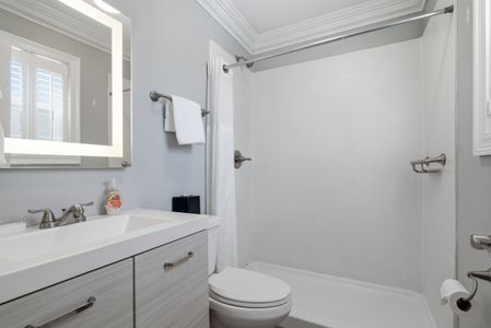 Unit 204 bathroom w/ clean modern style & all the essentials.