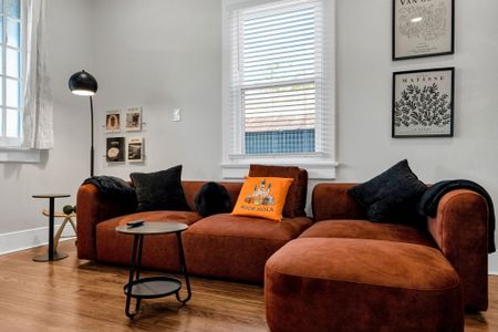 Gather on the oversized sectional by the window for a cozy movie night in