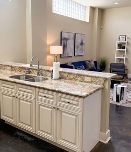Well-equipped kitchen with granite countertops and modern appliances