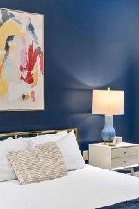 Blue ceramic lamp on a modern nightstand