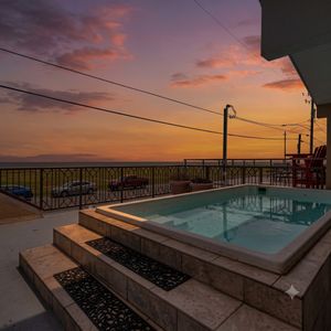 Soak in the sun on your private front-facing balcony w/ a temperature-controlled pool.