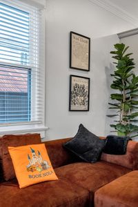 Cozy up w/ throw pillows in the sunny sitting area by the window