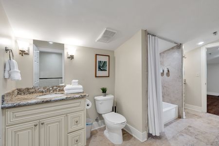 Clean, classic full bath with tub