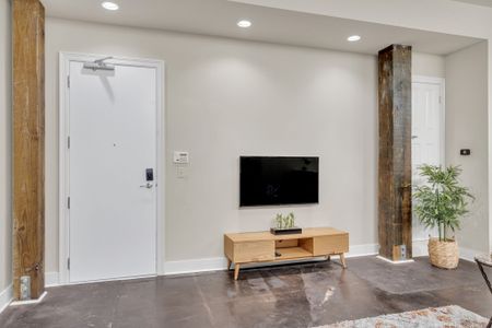 Keyless entry and a sleek Smart TV to greet you