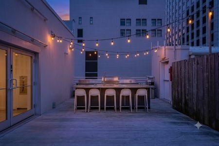 Expansive rooftop patio on the 5th floor — open sky, fresh air & room to breathe.