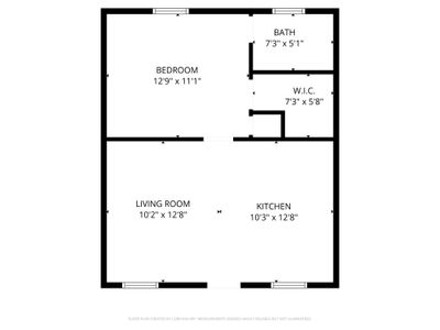 Clean floor plan showing bedroom, living room & kitchen layout.