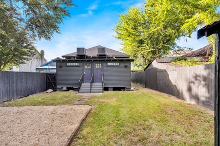 Charming home w/ a fully fenced yard & open green space to stretch out & relax