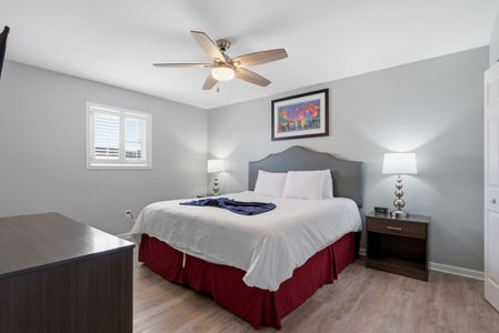 Unit 305 – Sun-kissed bedroom w/ a king bed & a breezy, relaxed vibe.
