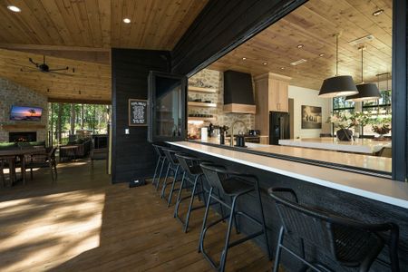Modern kitchen and dining area at Bear Lake Lodge, featuring a spacious island with seating