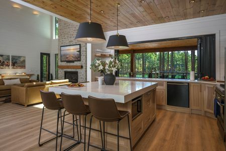 Luxurious kitchen island with seating in a spacious retreat, showcasing a modern design and expansive