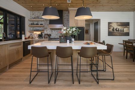 Luxurious kitchen and dining area at Bear Lake Lodge, showcasing an oversized island and modern