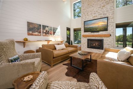 Luxurious living room at Bear Lake Lodge featuring a stone fireplace, modern furnishings, and large