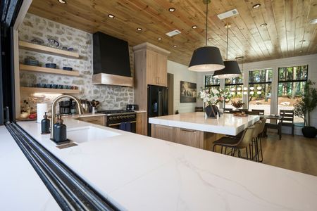 Luxurious kitchen interior at Bear Lake Lodge, showcasing a large island and modern appliances