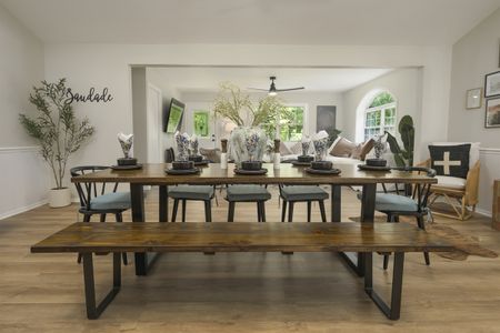 Elegant dining room setting in a modern North Texas home, showcasing a long wooden table