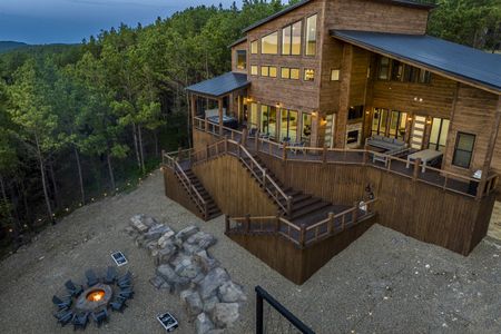 Luxury cabin "A View from the Top" in Broken Bow, featuring a spacious deck, outdoor