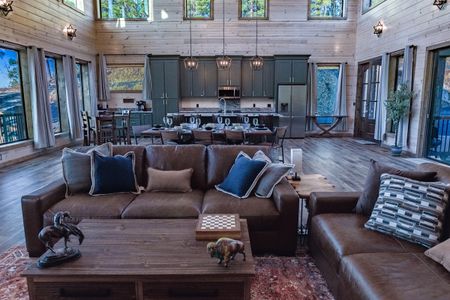 Cabin living room with leather seating and blue accent pillows