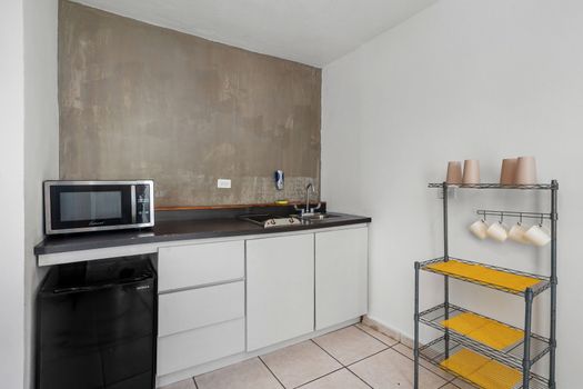 Discover tranquility and serenity in this contemporary kitchen, complete with a captivating view that adds to the ambiance of relaxation and peacefulness.