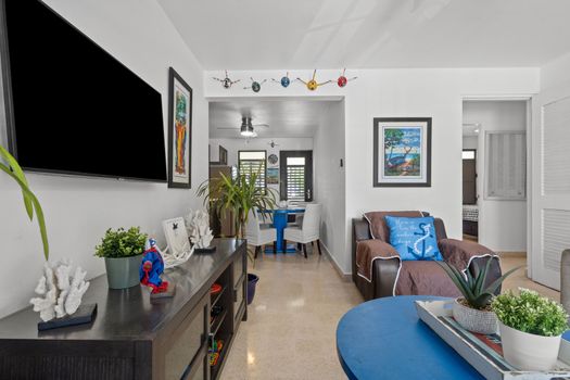 Your Home Away From Home: A spacious and inviting living room featuring plush seating and a serene ambiance, ideal for reconnecting with loved ones.