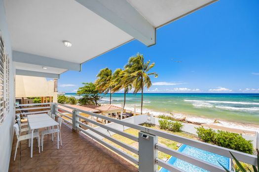 Fully equipped kitchen for home-cooked meals. Enjoy breakfast or dinner with natural light and a cozy island feel.