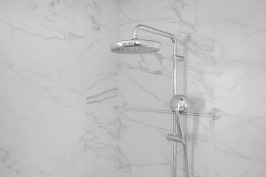 Invigorating rainfall shower in a sleek, modern bathroom.