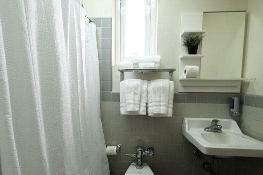 Find everything you need in our clean and functional bathroom, featuring plenty of fresh towels and a well-maintained space to ensure your comfort.