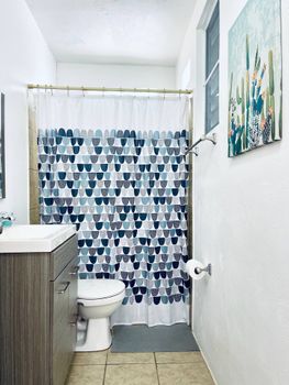 Freshen up in our sparkling clean bathroom, fully equipped with a refreshing shower, premium conditioner, body wash, and all the essentials for your convenience.