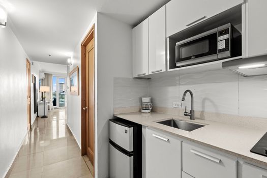 Experience a seamless transition from entry to your stylish studio, complete with essential kitchen amenities.