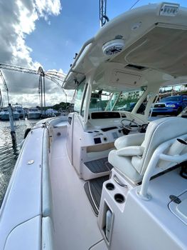 Vibrant marina scene under a brilliant sky! Enjoy the charm of a bustling dock with an array of boats and serene waters.