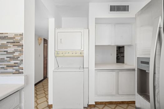 Experience the ease of a fully functional kitchen in your home away from home. With clean lines and essential appliances, it's perfect for preparing your favorite dishes.