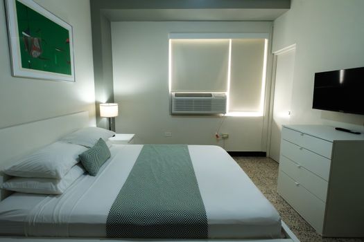 Experience ultimate comfort with our modern bedroom featuring effective blackout blinds for a restful night's sleep and individual climate control for your perfect temperature.