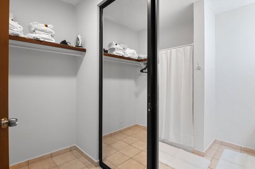 Ample closet space with built-in shelving to keep your belongings organized throughout your stay.