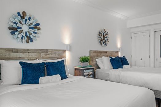 Enjoy the best of both worlds in this versatile space, offering comfortable sleeping arrangements for four, a convenient table for dining or remote work, and a gorgeous ocean backdrop.