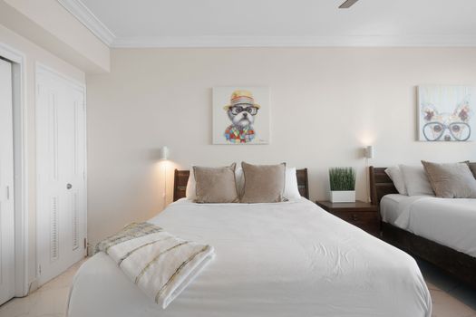 Relax in style! Our double queen room provides ample space, cozy bedding, and a refreshing coastal ambiance