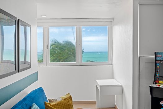 Experience serenity and entertainment in one space. Relax on the cozy couch or engage in some retro gaming, all while soaking in the stunning ocean views just outside your window.