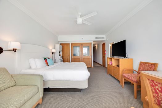 Relax and unwind in a beautifully appointed space with a comfortable king-size bed and a large flat-screen TV for your entertainment.