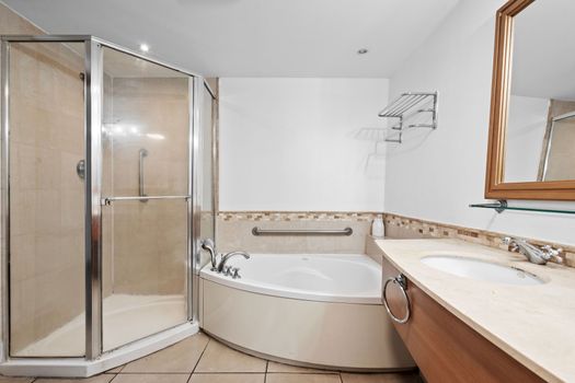 Step into our modern, glass-enclosed shower, designed for a refreshing and comfortable experience. With ample space and clean lines, it's the perfect spot to wash away the day and feel revitalized