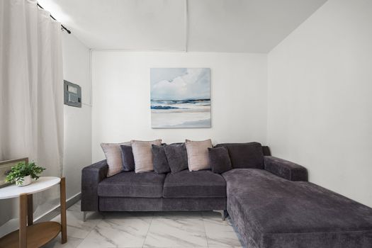 Inviting lounge space with ceiling fan.