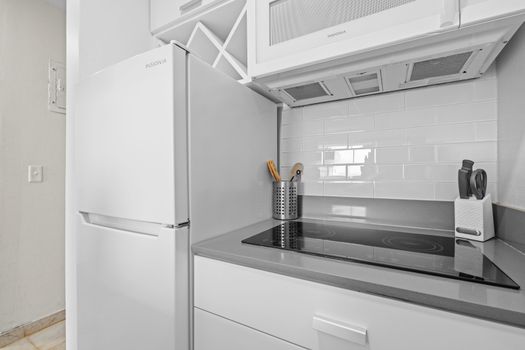 Start your day in this sleek kitchen with convenient appliances