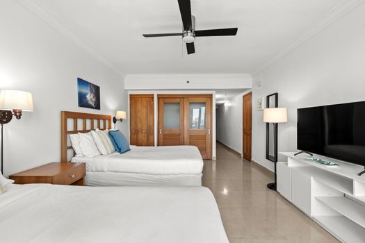 Bright and airy studio with two comfortable beds and stunning views through balcony doors.
