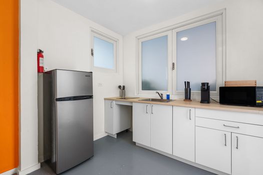 Morning essentials at your fingertips: a compact, convenient kitchenette for a quick start to your day in the city.