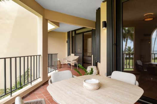 Step onto your private balcony and savor refreshing breezes with glimpses of the sparkling pool. Your perfect escape!