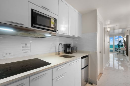 "Whip up your favorite breakfast or a quick lunch in this bright and functional kitchenette